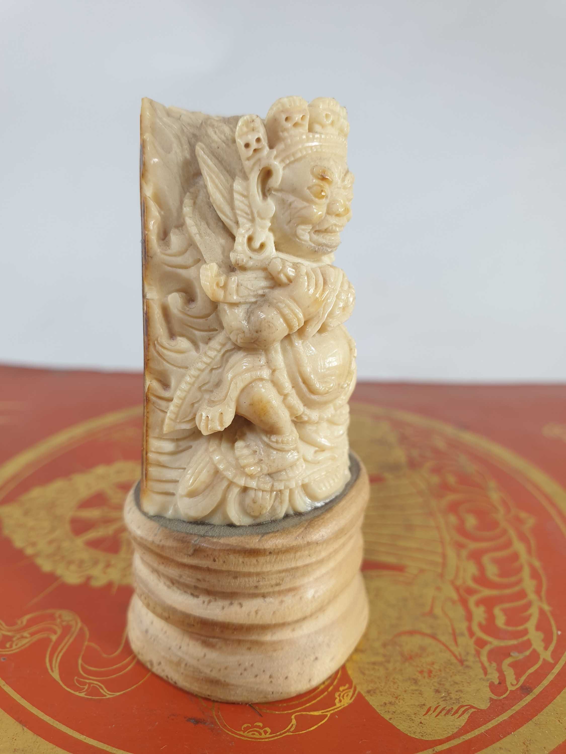 Buddhist Mahakala Carved In Yak Bone, On A Wooden Stand