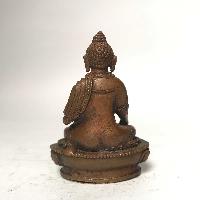 Tiny Tibetan Statue Of Ratnasambhava Buddha, [chocolate Oxidized]